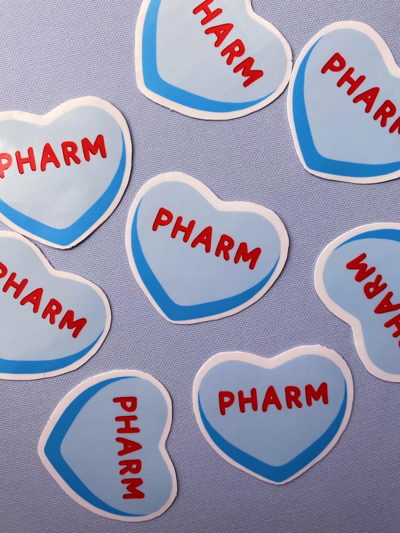 May include: Seven blue heart-shaped stickers with a white outline and the word "PHARM" written in red letters.