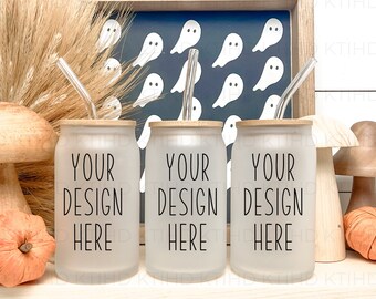 May include: Three frosted glass tumblers with bamboo lids and clear straws. Each tumbler has the text "YOUR DESIGN HERE" printed on the front. The tumblers are arranged in a row on a white surface with autumnal decor.