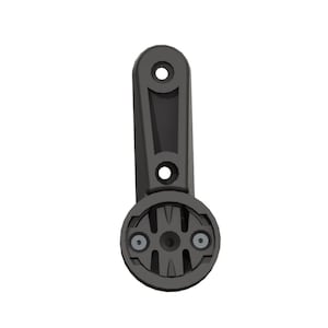 May include: A dark gray bicycle computer mount. The mount has a circular base with two screws and a vertical arm with two holes for mounting. The mount is designed to hold a bicycle computer.