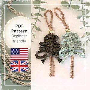 May include: Two macrame Christmas tree ornaments, one dark green and one light green, with gold beads and tan hanging loops. The image includes the text "PDF Pattern Beginner friendly" and the flags of the United States and the United Kingdom.