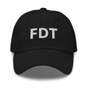 May include: A black baseball cap with a white embroidered "FDT" on the front.