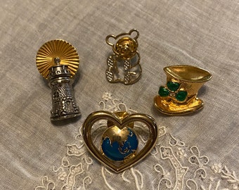 Wow!  4 Vintage Avon Brooches - St. Patrick's Day Hat, Teddy Bear, Christian Lighthouse, Heart with World Globe