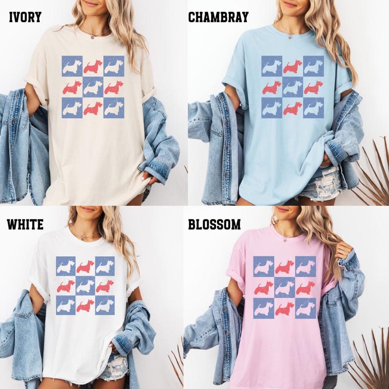 May include: A graphic tee shirt with a checkered pattern featuring a silhouette of a dog in red, blue, and white. The shirt is available in four colors: ivory, white, chambray, and blossom.