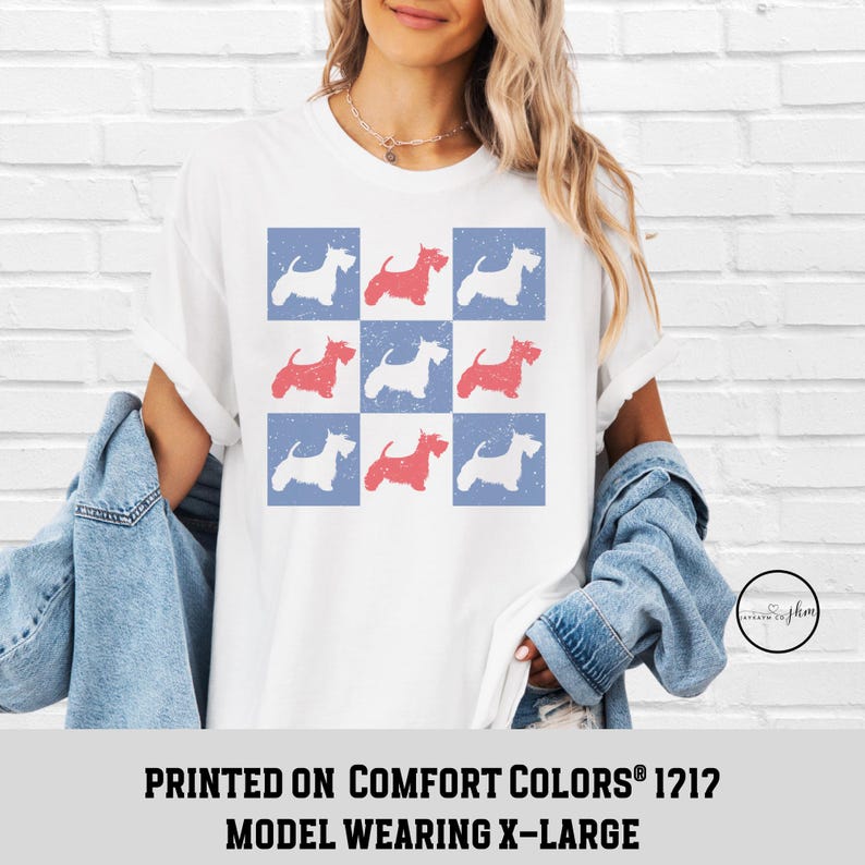 May include: White t-shirt with a red, white, and blue pattern of Scottish Terrier silhouettes. The text "PRINTED ON COMFORT COLORS&reg; 1212 MODEL WEARING X-LARGE" is printed below the image.