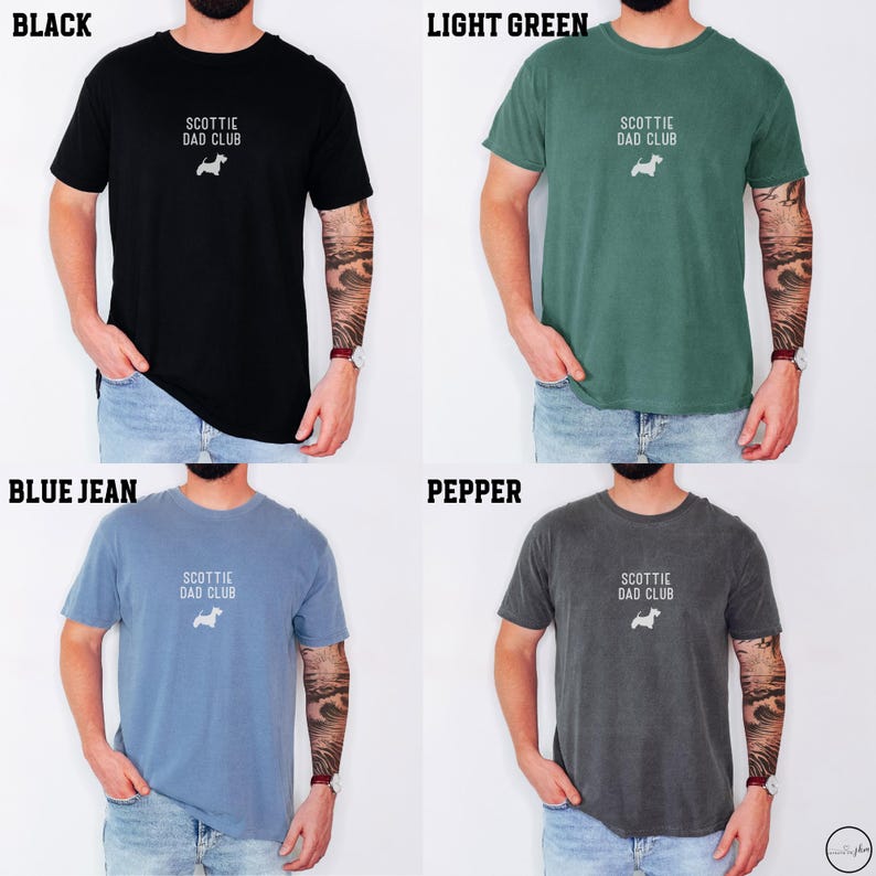 May include: Four t-shirts in black, light green, blue jean, and pepper colors. Each shirt has the text "SCOTTIE DAD CLUB" and a small white dog graphic. The shirts are short-sleeved.