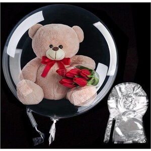 May include: A plush teddy bear with a red bow and a bouquet of red tulips inside a clear, round balloon. The balloon is sealed and ready for gifting. The background is black.
