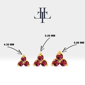 May include: Three gold earrings with three red gemstones each. The earrings are available in three sizes: 4.30 mm, 5.20 mm, and 5.80 mm.