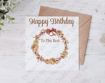 Pode incluir: Um cartão de felicitações quadrado branco com um envelope castanho. O cartão apresenta uma guirlanda em aguarela de abóboras, folhas de outono e bagas, com um laço vermelho. O texto diz Happy Birthday e To The Best em castanho.