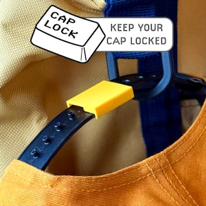 Cap Lock - Stops your snapback cap from coming undone - Securely attach your cap to your bag
