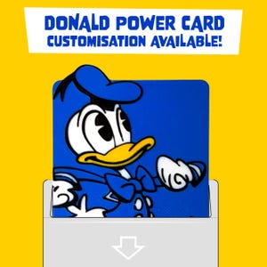 May include: A square blue card featuring a graphic of Donald Duck in a blue sailor outfit and hat. The text DONALD POWER CARD CUSTOMISATION AVAILABLE! is printed in blue at the top. A white envelope with a downward pointing arrow is at the bottom.