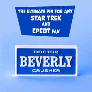May include: A blue and white pin with the text "DOCTOR BEVERLY CRUSHER" in white. The pin is rectangular with a white border. Above the pin is a blue banner with the text "THE ULTIMATE PIN FOR ANY STAR TREK AND EPCOT FAN" in white.