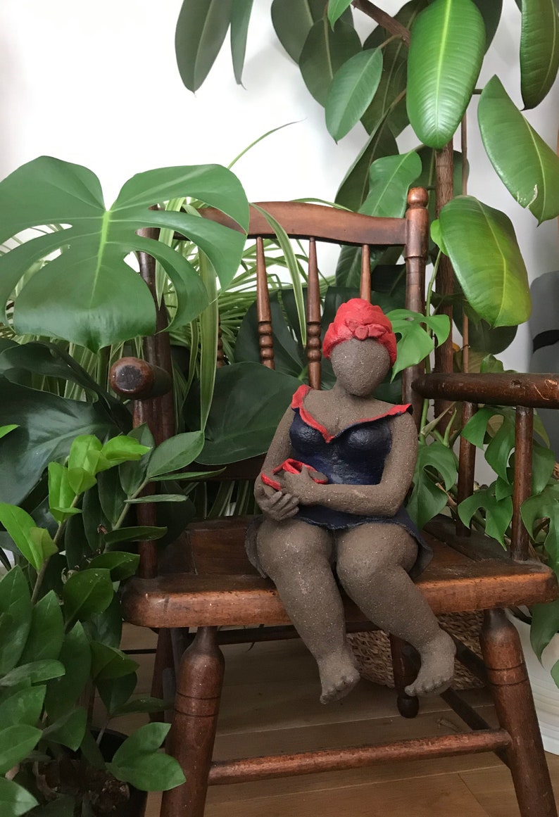 French manufacturing. Ceramic sculpture of a woman in a dark blue dress with a red turban