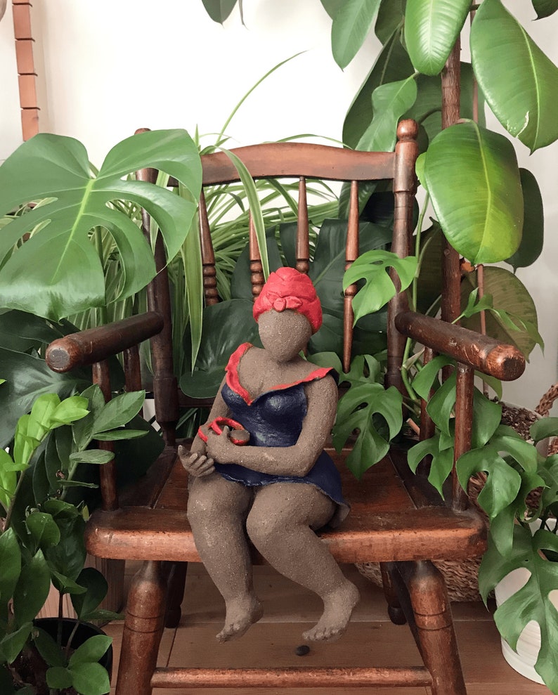 French manufacturing. Ceramic sculpture of a woman in a dark blue dress with a red turban