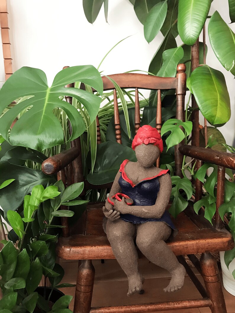 French manufacturing. Ceramic sculpture of a woman in a dark blue dress with a red turban