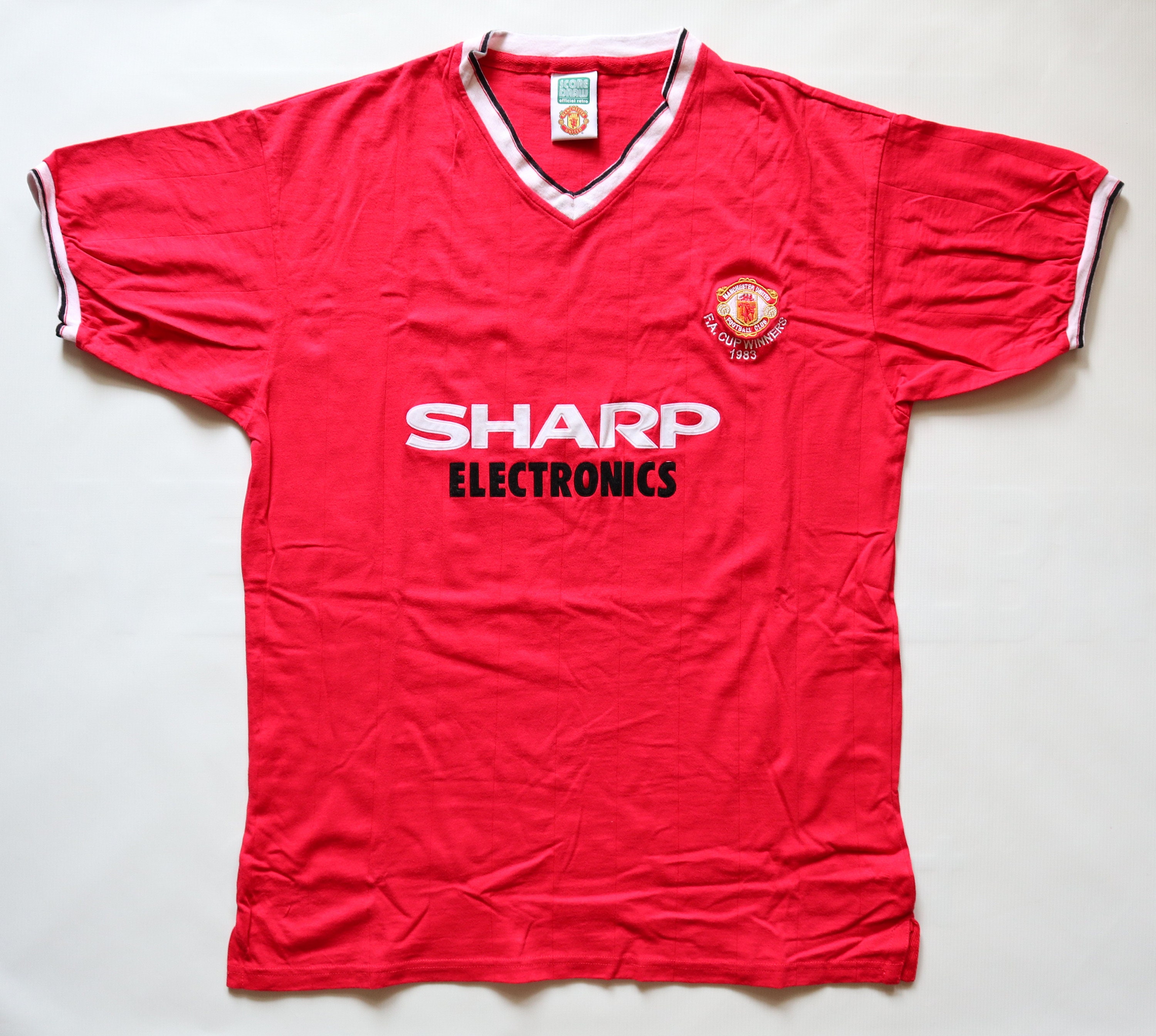 sharp electronics man utd shirt