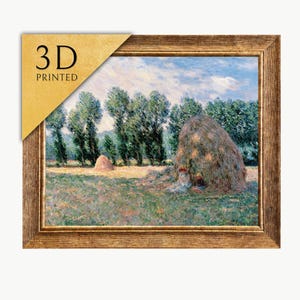 May include: A framed 3D printed artwork showing a rural landscape with haystacks and trees under a cloudy sky. The artwork is in a gold-coloured frame. The text "3D PRINTED" is in the upper left corner.