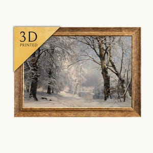 May include: A framed landscape print depicting a snow-covered forest scene with bare trees and a frozen stream. The rectangular frame has a textured brown finish. A gold-colored triangular corner tag features the black text 3D PRINTED.