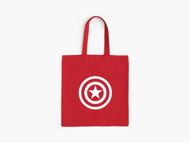 K&ouml;nnte beinhalten: Rote Tragetasche mit wei&szlig;em Captain America Schild-Design. Die Tasche hat eine rechteckige Form mit Henkel. Das Design ist ein wei&szlig;er Kreis mit einem Stern in der Mitte.