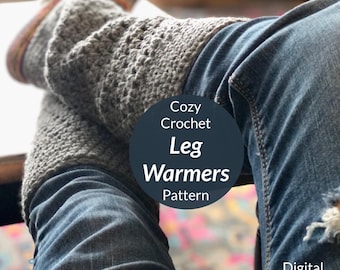 May include: Cozy Crochet Leg Warmers Pattern - Digital Download. A pair of gray crochet leg warmers are worn over blue jeans.