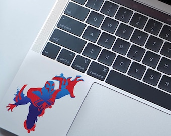 May include: A red and blue silhouette of a superhero with a mask, in a dynamic pose, on a laptop.