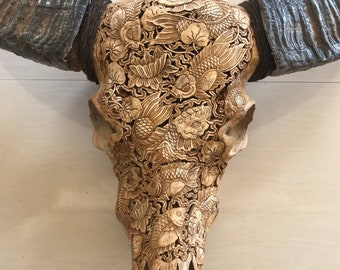 Carved buffalo skull Japanese art of fish
