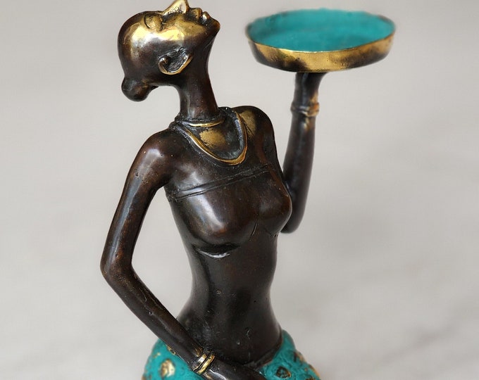 Brass women hold candle for sculpthure