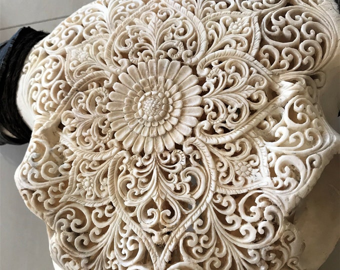 carved buffalo skull carving Mandala sun flower