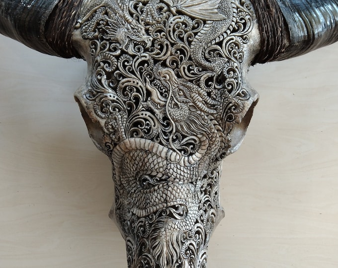 carved buffalo skull dragon fight grey