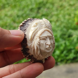 Hand-Carved Tribal Face Pendant – Natural Antler/Bone Art