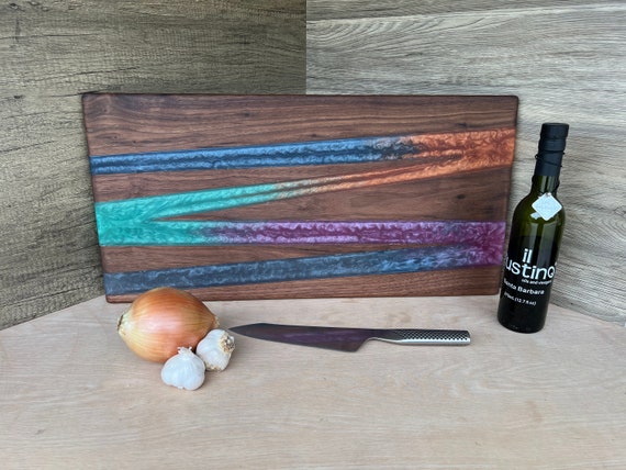 Exotic Walnut and Colorful Resin cutting/charcuterie board deals with carved handle