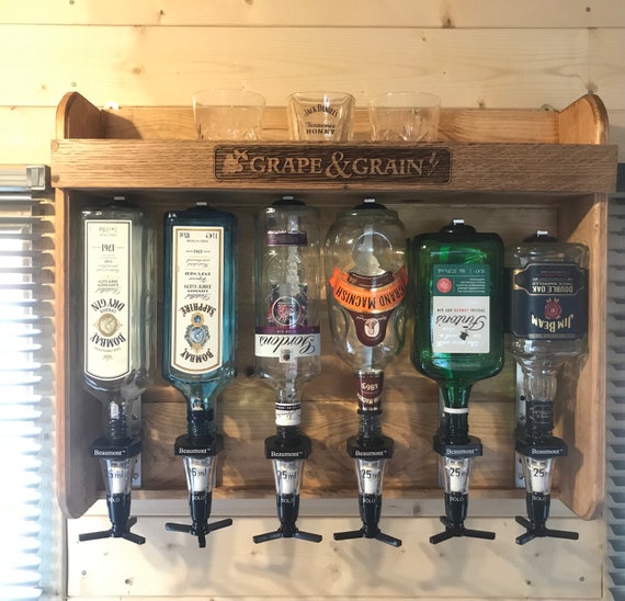 Spirit outlet optic dispenser