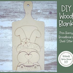 May include: A white ceramic mug with a black handle and the text "But First, Coffee" in a black, bold font. The mug is likely 4 inches tall and holds approximately 12 ounces of liquid.