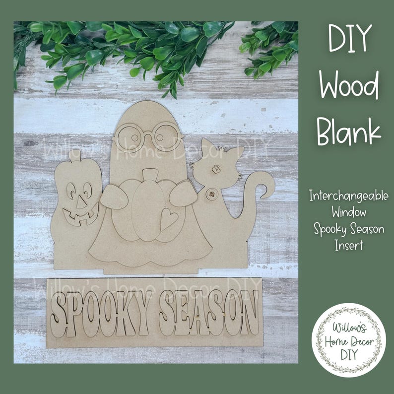 May include: DIY wood blank with interchangeable window insert for spooky season. The blank features a ghost, pumpkin, and cat. The insert reads "Spooky Season".