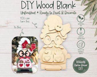 May include: An unfinished laser-cut wood blank shaped like a character with a large bow, glasses, and an apron with two heart-shaped pockets. The image includes a finished, painted example showing the character with red and white accents.