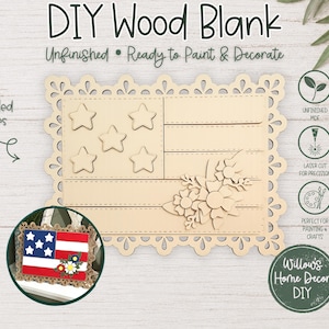 May include: A DIY wood blank in the shape of an American flag, ready to paint and decorate. The unfinished wood piece includes laser-cut details and a decorative border. The text "DIY Wood Blank" and "Unfinished • Ready to Paint & Decorate" are visible.