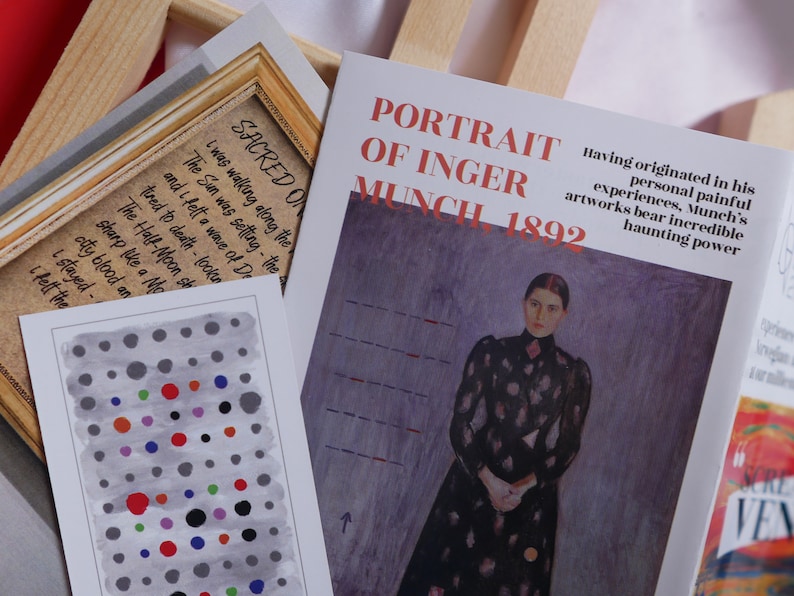 May include: A close-up of a book cover with the title "Portrait of Inger Munch 1892". The cover features a painting of a woman in a black dress with a patterned design, standing against a purple background. The text "Having originated in his personal painful experiences, Munch's artworks bear incredible haunting power" is printed below the painting.