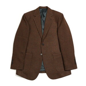 May include: A brown and black plaid blazer with a single button closure. The blazer has two flap pockets and a lined interior.