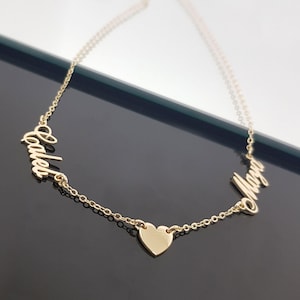 Collana personalizzata con due nomi e cuore, gioiello delicato in argento sterling.