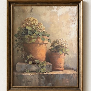 May include: A framed painting depicts two terracotta pots filled with hydrangeas and trailing vines. The pots sit on a weathered stone surface against a neutral background. The artwork is enclosed in a gold-toned wooden frame.
