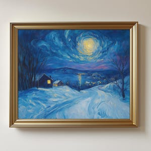May include: A framed landscape painting depicts a snowy scene under a moonlit sky. The artwork features a winding path leading to a small house with a lit window, set against a backdrop of mountains and a starry night. The frame is gold.