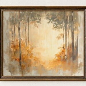 May include: An oil painting of a forest scene in a gold-toned wooden frame. The artwork depicts tall trees in shades of gray and brown, with golden light illuminating the center. Autumnal foliage in orange and yellow hues adds warmth to the landscape.