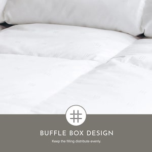 May include: White down comforter with a baffle box design. The design helps keep the filling evenly distributed.