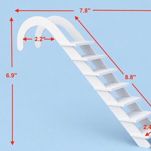May include: A white wooden ramp with stairs, measuring 6.9 inches high, 7.8 inches wide, and 8.8 inches long. The ramp has a curved top and six steps. The width of the top curve is 2.2 inches, and the depth of the steps is 2.4 inches.