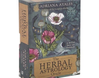 May include: The Herbal Astrology Oracle deck box features a dark blue background with a floral design and a crescent moon. The text on the box reads "The Herbal Astrology Oracle" and "A 55-Card Deck and Guidebook".