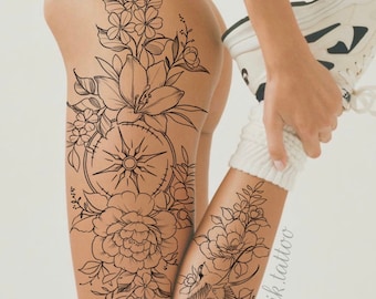 May include: Black line art tattoo design of flowers, a compass, and a bird on a leg. The design is on a white background.