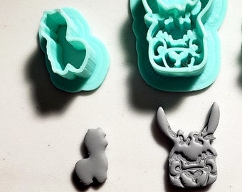 May include: A set of three cookie cutters in the shape of llamas. The cutters are made of a light blue plastic and are shown on a white surface. The cutters are in different sizes and have a detailed design. The text "Blessed Eli" is visible in the lower right corner of the image.