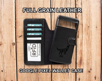 May include: A black full grain leather wallet case for a Google Pixel phone. The interior features multiple card slots and a white card with the text RFID Protection. The exterior cover displays an engraved wolf graphic and the name DAN.