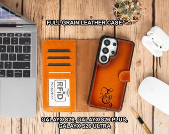 May include: An open, brown leather phone case with card slots and a matching phone case. The phone case has the name "Edward" engraved on it. The text "FULL GRAIN LEATHER CASE" and "GALAYX S26, GALAYX S26 PLUS, GALAYX S26 ULTRA" are also visible.