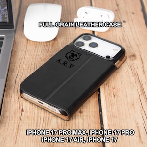 May include: Black full-grain leather iPhone case with the text "FULL GRAIN LEATHER CASE". The case has the initials "A.R.V" and a bear logo. Compatible with iPhone 17 Pro Max, 17 Pro, 17 Air, and 17 models.