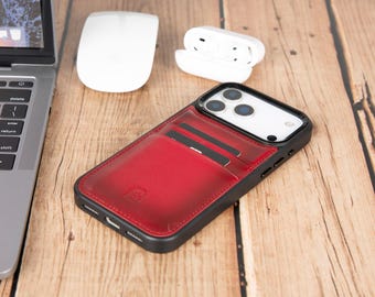 May include: A smartphone case with a black frame and a red leather back panel featuring two integrated card slots. The case is designed with a cutout for the triple-lens camera system and includes a small embossed logo on the lower red section.